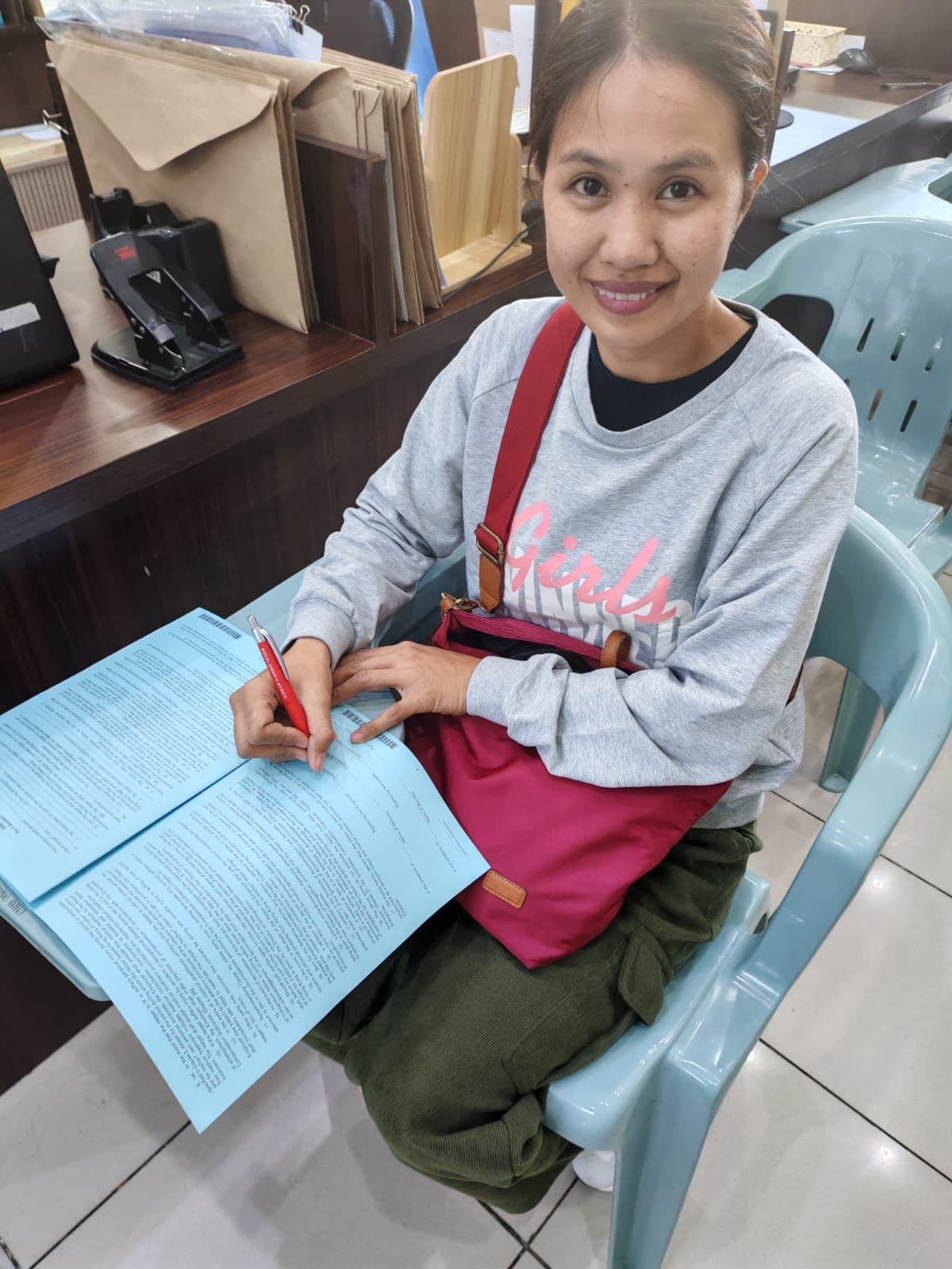 Helper signing contract with PY Cares