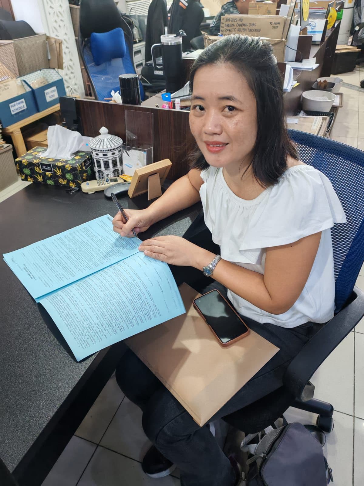 Helper completing paperwork with PY Cares